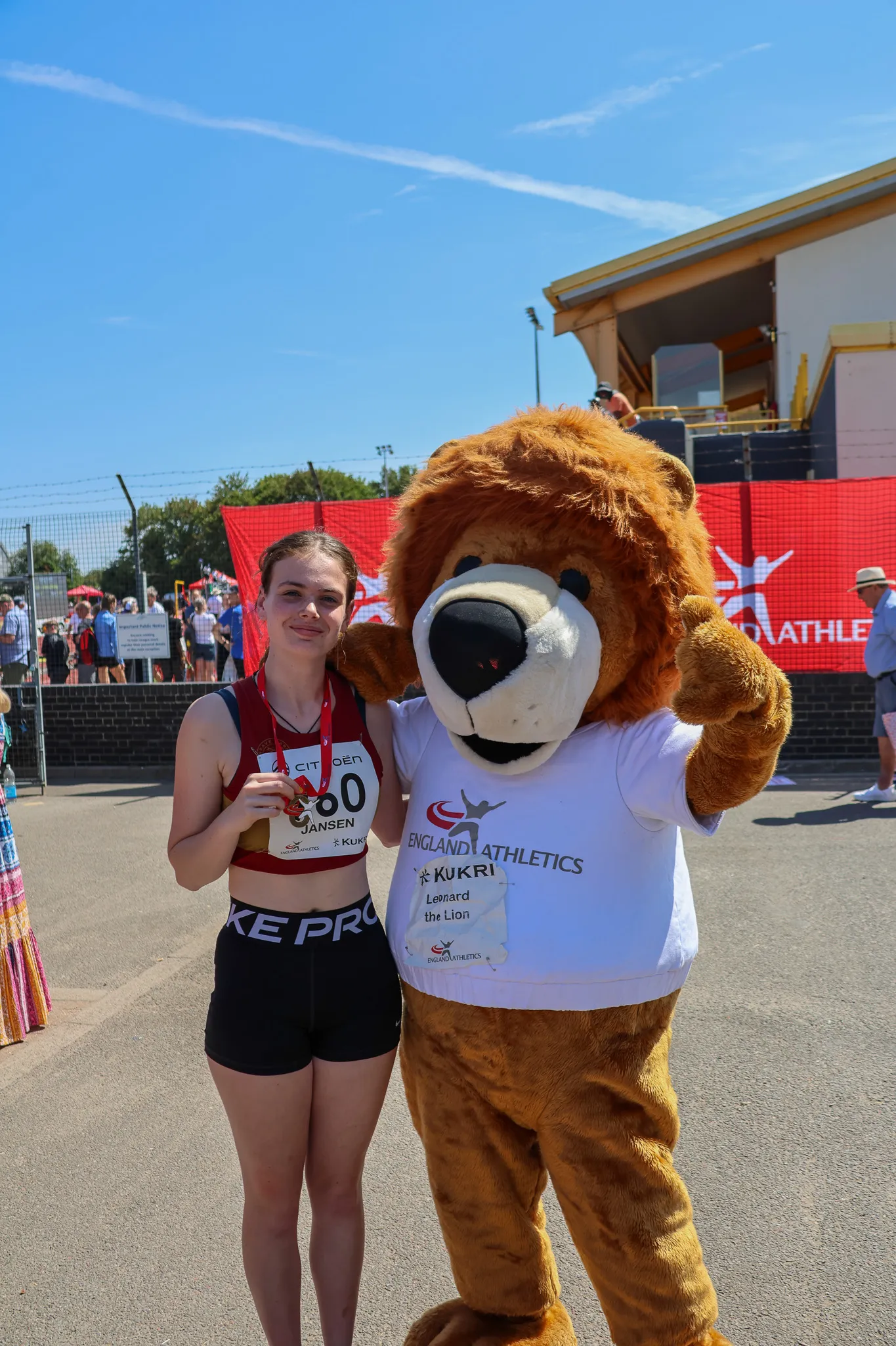 SpeedPro athlete Neva Jansen with her U18 discus bronze medal and the England Athletics mascot at the 2026 National Championships