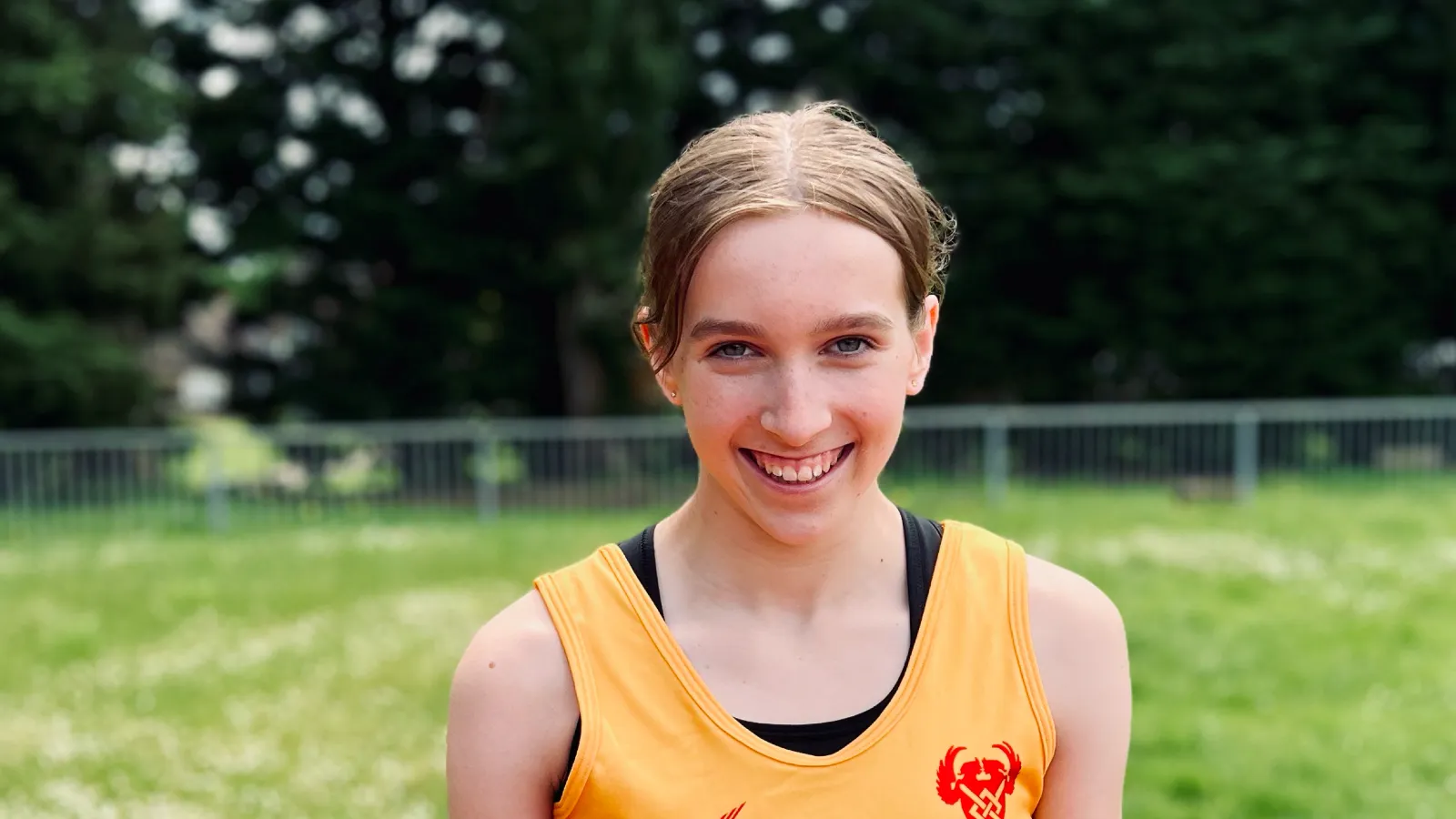 SpeedPro athlete Freya McAndie smiling in her club vest