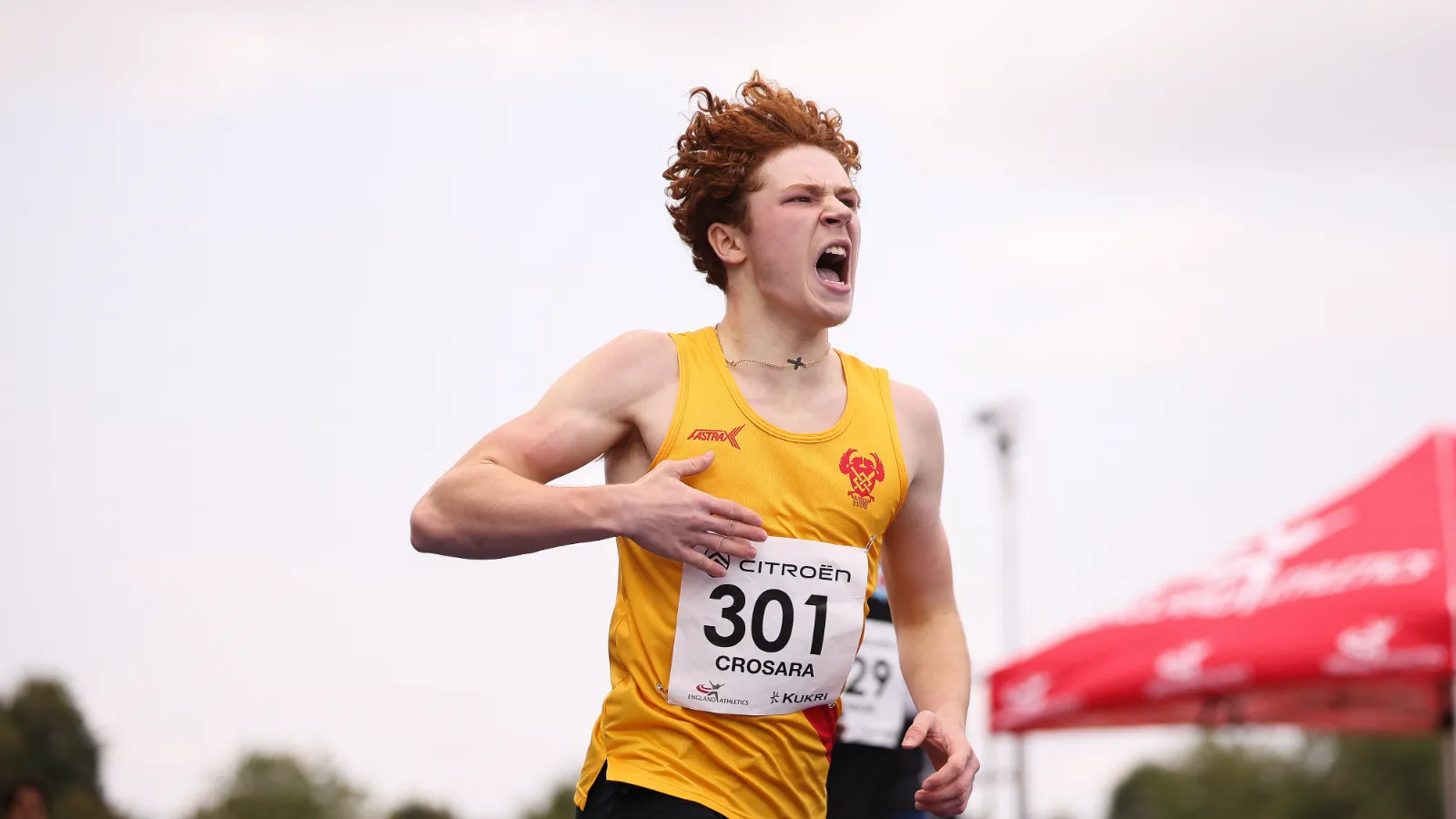 SpeedPro athlete Tommaso Crosara celebrating as he crosses the line to win national 300m gold