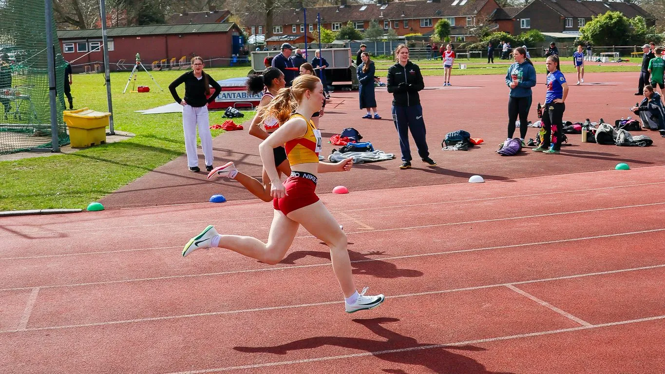 SpeedPro sprinter racing down the home straight at the Bracknell athletics meeting