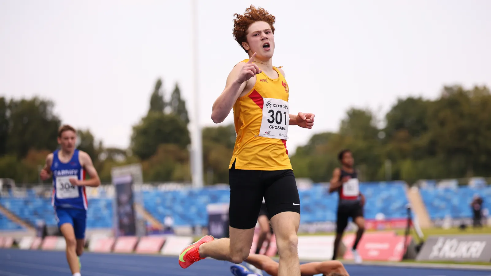 SpeedPro athlete Tommaso Crosara, number 301, celebrating as he wins the national U15 300m title in Birmingham
