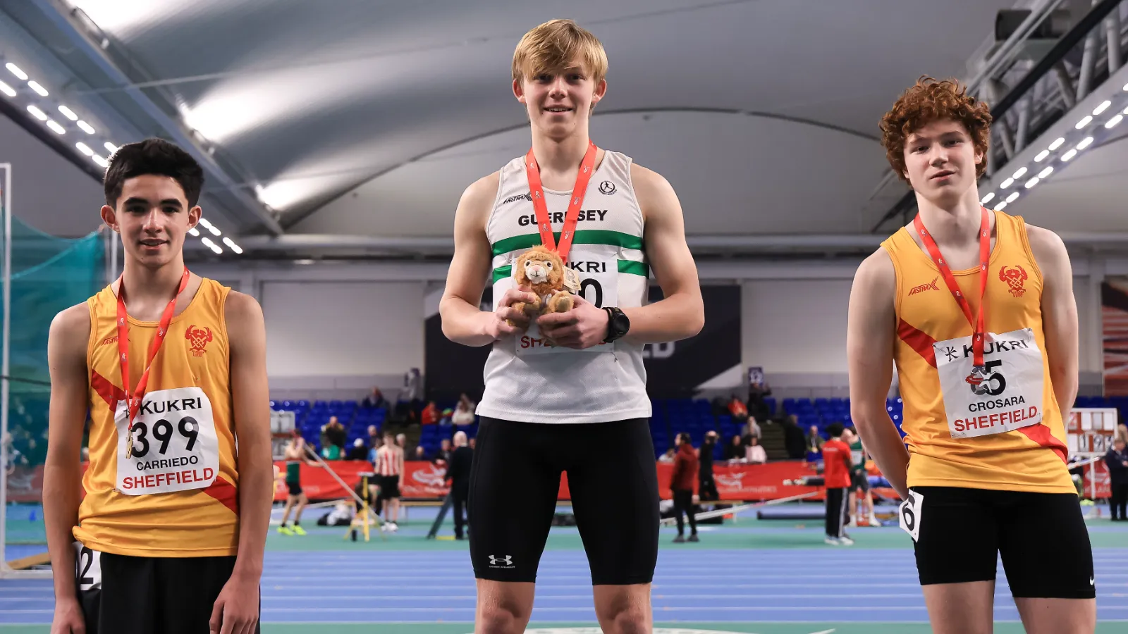 Tommaso Crosara on the podium with his 300m silver medal at the Indoor National Championships in Sheffield