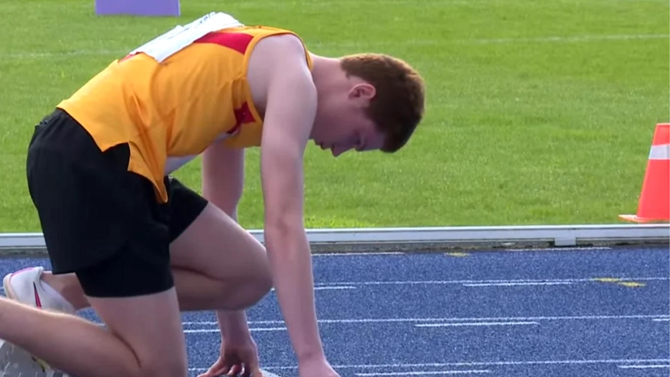 SpeedPro athlete Tommaso Crosara settling into his blocks before the U15 300m at the National Championships