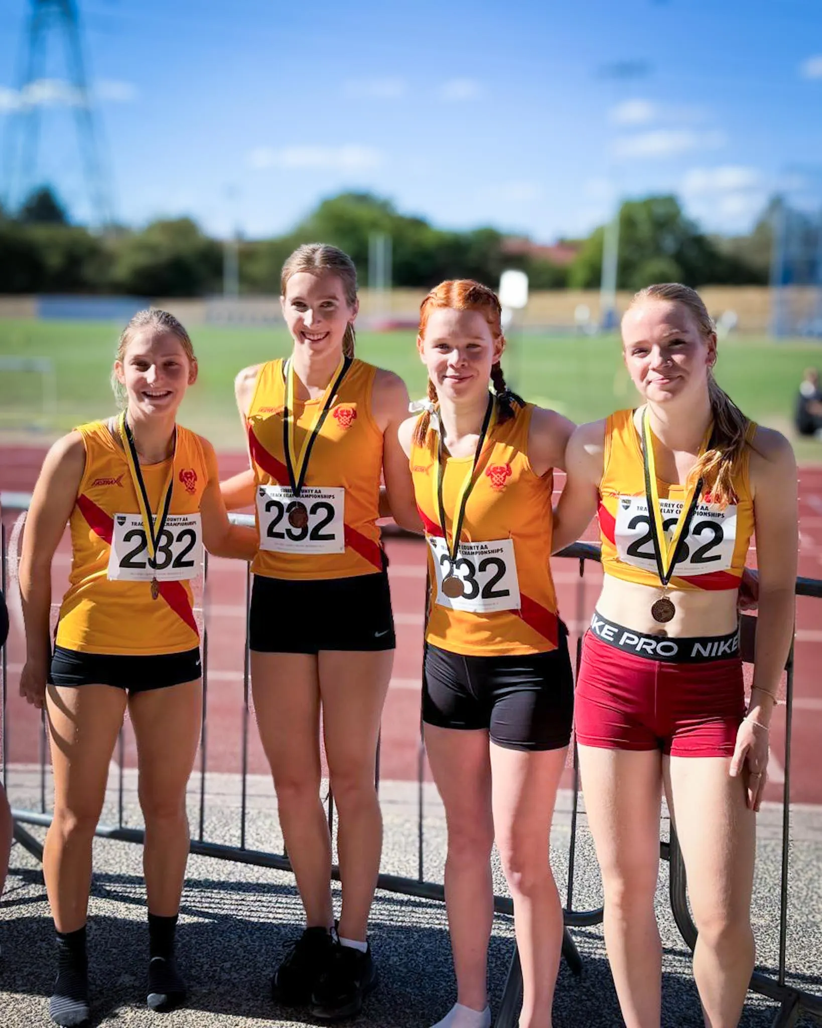 SpeedPro girls relay team with their bronze medals at the 2026 Surrey County AA Track Relay Championships